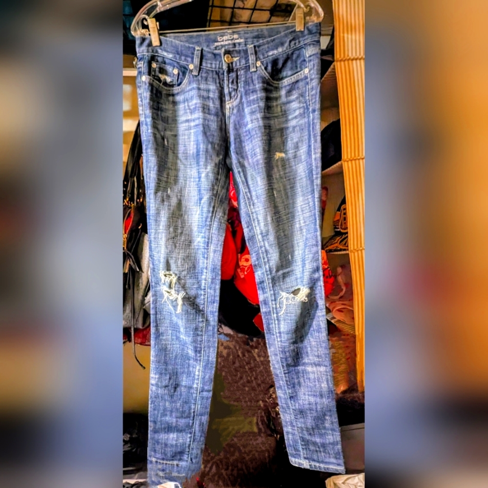 Bebe Distressed Skinny Jeans with Pink Embroidery